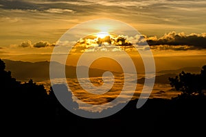 Silhouette of Sunrise and mist with mountain at Huai Nam Dang National Park in Chiang Mai and Mae Hong Son, Thailand