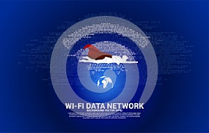 silhouette of superhero fly with world with wi-fi mobile data icon with one and zero binary code matrix.