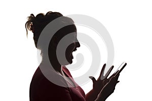 Silhouette surprise exclamation girl with mobile smart phone, using - isolated