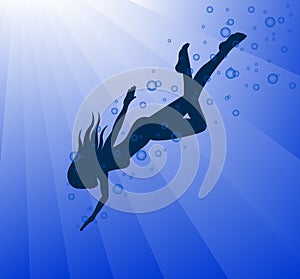 Silhouette of swimming woman surrounded by bubbles