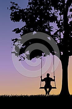Silhouette on swing at sunset