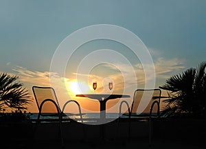 Silhouette of a table with two goblets