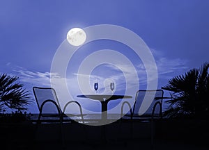 Silhouette of a table with wine glasses