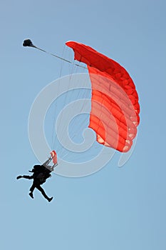 Silhouette of Tandem Sky Divers Landing