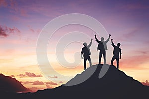 Silhouette of a team celebrating a victory against sunset background, concept of victory and leadership