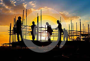 Silhouette of teamwork construction crew, building construction worker working togetherat site