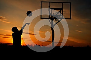 Silhouette of a Teen Boy shooting a Basketball