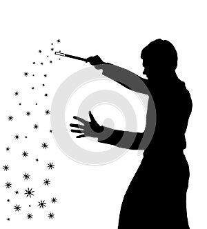 Silhouette of teenage boy wizard creating magic