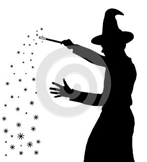 Silhouette of teenage boy wizard with hat creating magic