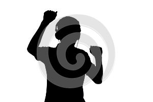 silhouette of teenager listening to music in headphones and dancing on white isolated background
