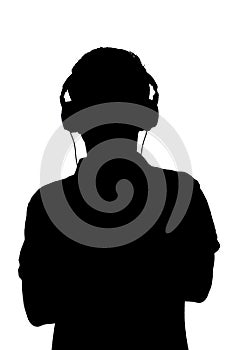 Silhouette of teenager listening to music in headphones, man folded his arms on the chest on white isolated background