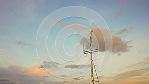 Silhouette of the telephone antenna at sunrise