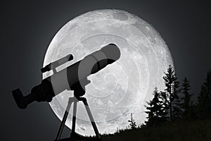 Silhouette of telescope and big moon in background. Astronomy and exploration of universe concept.