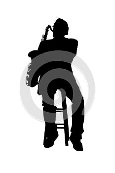 Silhouette of a tenor saxophone player photo