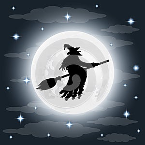 Silhouette of a terrible old witch on a broomstick on full moon