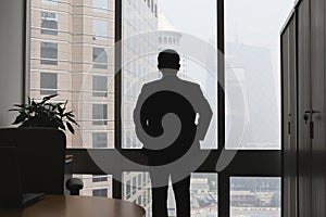 Silhouette of thinking businessman