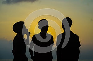 Silhouette of three children