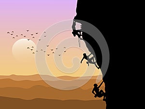 Silhouette of three mountain climbers climbing with sunset  background