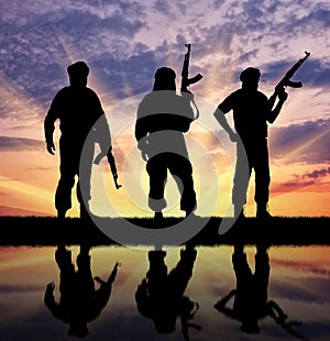 Silhouette of three terrorists