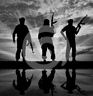 Silhouette of three terrorists