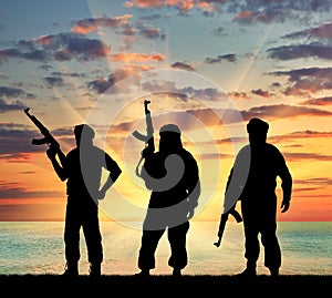 Silhouette of three terrorists