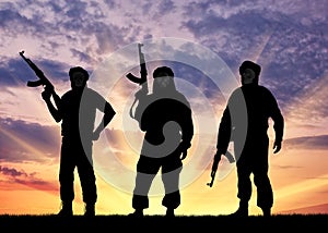 Silhouette of three terrorists