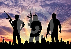 Silhouette of three terrorists