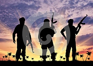 Silhouette of three terrorists photo