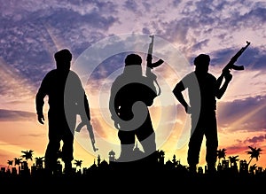 Silhouette of three terrorists photo