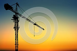 a silhouette tower crane for construction