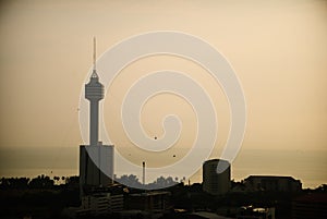 The silhouette of the Towers in the city of Pattaya on the sunset sky background