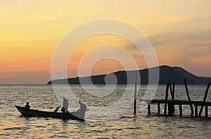 Silhouette of traditional fishing boat at sunrise, Koh Rong island, Cambodia