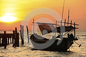 Silhouette of traditional fishing boat at sunrise, Koh Rong island, Cambodia