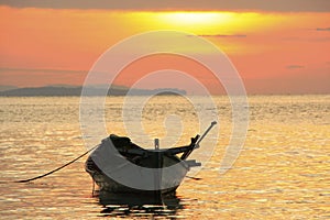 Silhouette of traditional fishing boat at sunrise, Koh Rong island, Cambodia