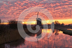 Windmill with intense morning red, De Rietveldse Molen, Hazerswoude Dorp photo