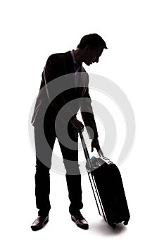 Silhouette of Traveling Businessman Checking in Luggage