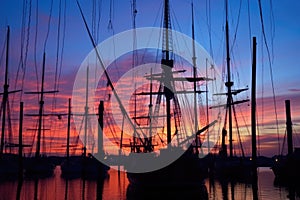 silhouette of trawlers mast and rigging against twilight sky