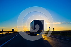 Silhouette of a truck at sunset