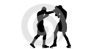 Silhouette of two boxers which are boxing. Slow motion