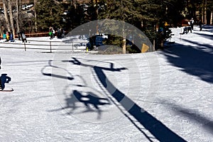 Silhouette of two people taking sky lift