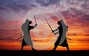 Silhouette of two samurais in duel.