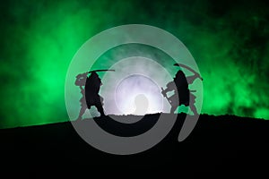 Silhouette of two samurais in duel. Picture with two samurais and sunset sky