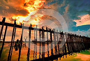 Silhouette U Bein Bridge and people at sunset Ayeyarwady River, Mandalay, Myanmar