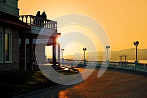 Silhouette of unidentified buildings during sunrise sunset with dramatic orangish color sky