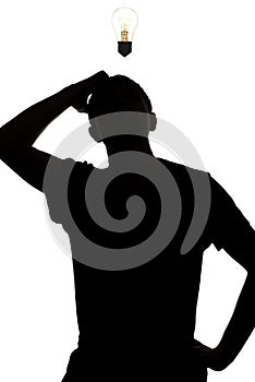 Silhouette of an unknown man thinking how to solve the problem, confusedly the scaly head on a white isolated background, concept