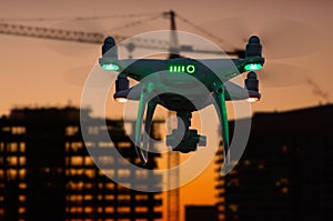 Silhouette of Unmanned Aircraft System UAV Quadcopter Drone photo