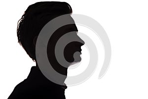 Silhouette of an unrecognizable guy, man face profile on a white isolated background