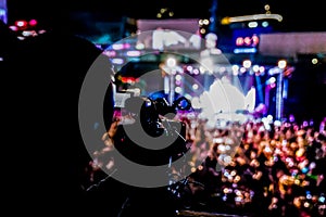 Silhouette videographer had been recorded to blurred and bokeh countdown concert., Bangkok, Thailand