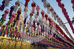 Silhouette view of colorful hanging Tung flags in Lanna temples during Loy Kratong festival
