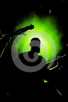 Silhouette view of a guitar player